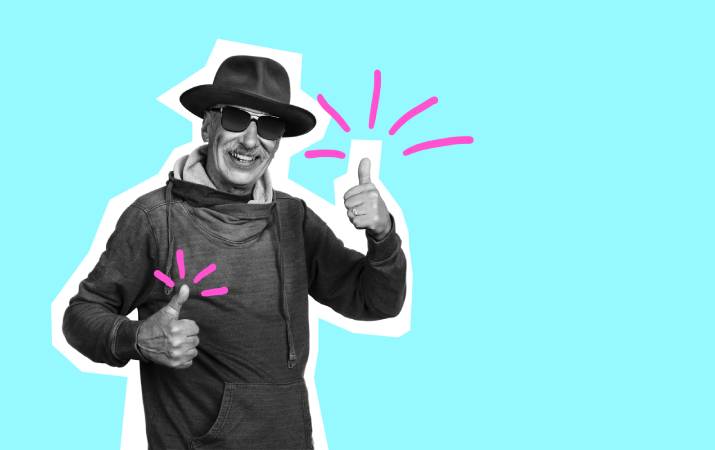 A senior man smiling with his thumbs up