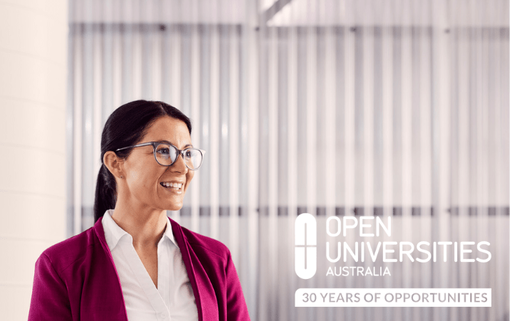 Open Universities Australia student, Melissa, wearing professional clothes in a workplace setting.